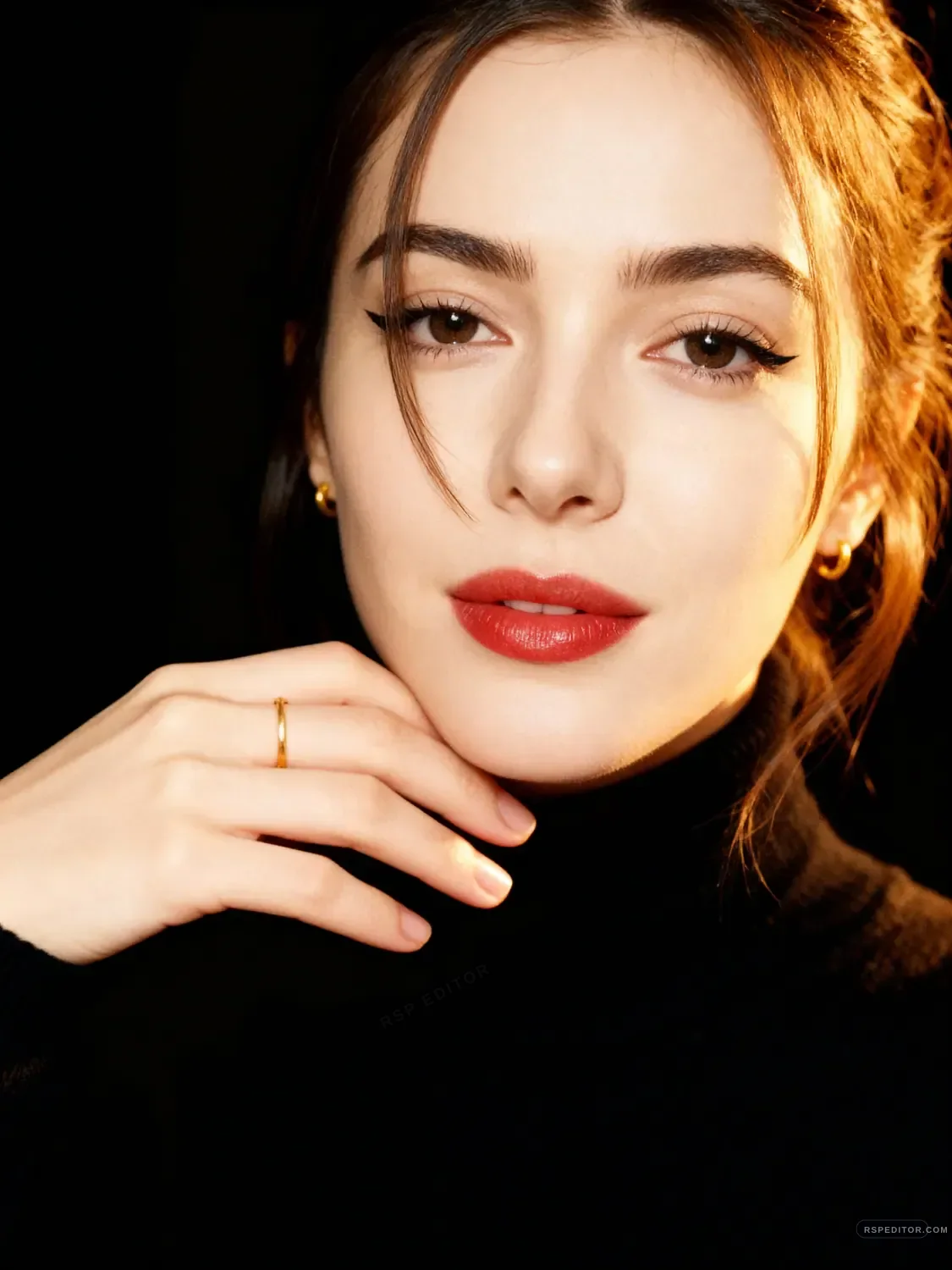 Close-up polaroid beauty portrait with black background and warm side light